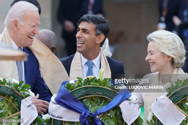 President Joe Biden , Britain's Prime Minister Rishi Sunak and European Commission President Ursula von der Leyen pay respect at the Mahatma Gandhi...