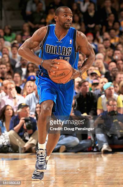 Mike James of the Dallas Mavericks controls the ball against the Denver Nuggets at the Pepsi Center on April 4, 2013 in Denver, Colorado. The Nuggets...