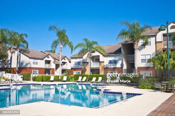 condominiums with swimming pool - suburban apartments stock pictures, royalty-free photos & images