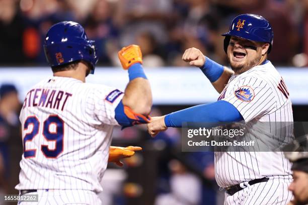 Stewart of the New York Mets is greeted by Daniel Vogelbach of the New York Mets after hitting a three-run home run during the fourth inning against...