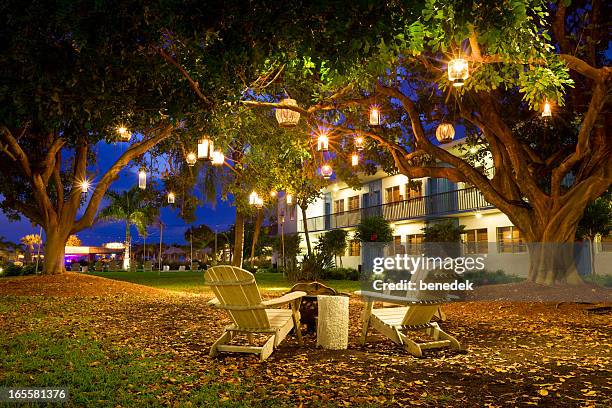 summer resort garden lanterns and chairs - show garden stock pictures, royalty-free photos & images