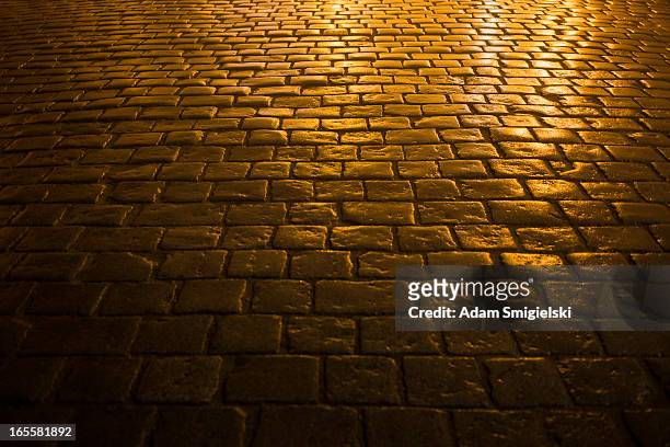 cobbled road - brick road stock pictures, royalty-free photos & images