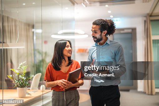 Young Multicultural Colleagues Utilizing Digital Technology Young Multicultural Colleagues Utilizing Digital Technology