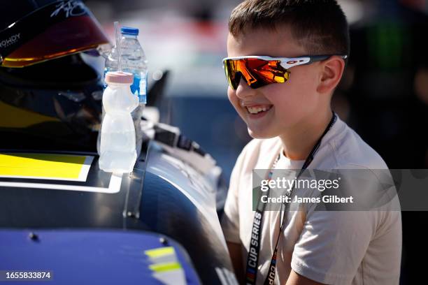 Brexton Busch enters the LA Golf Chevrolet, driven by his father, Kyle Busch on the grid prior to the national anthem prior to the NASCAR Xfinity...