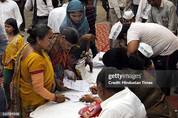 People bringing their water and electricity bill to the volunteers at Sunder Nagari on April 4, 2013 in New Delhi, India. The fast of AAP leader...