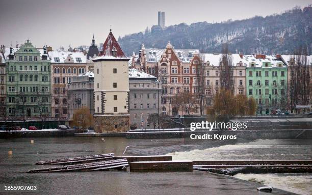 vitava river winter cityscape - czech republic river stock pictures, royalty-free photos & images