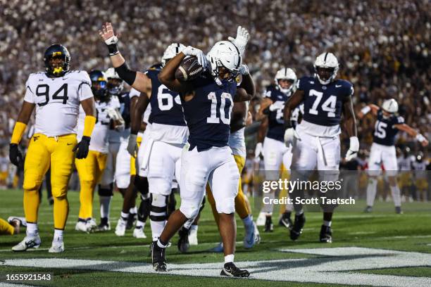 Nicholas Singleton of the Penn State Nittany Lions celebrates after scoring a touchdown against the West Virginia Mountaineers during the first half...