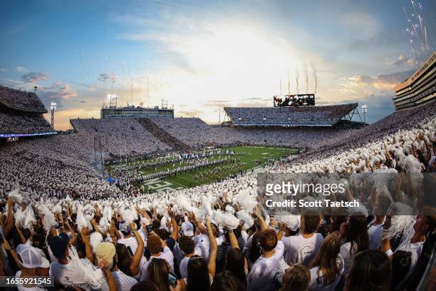 General view as the Penn State Nittany Lions take the field while fireworks are displayed before the game against the West Virginia Mountaineers at...