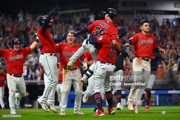 Will Brennan celebrates with Steven Kwan of the Cleveland Guardians after Kwan hit a walk-off sacrifice fly to defeat the Tampa Bay Rays at...