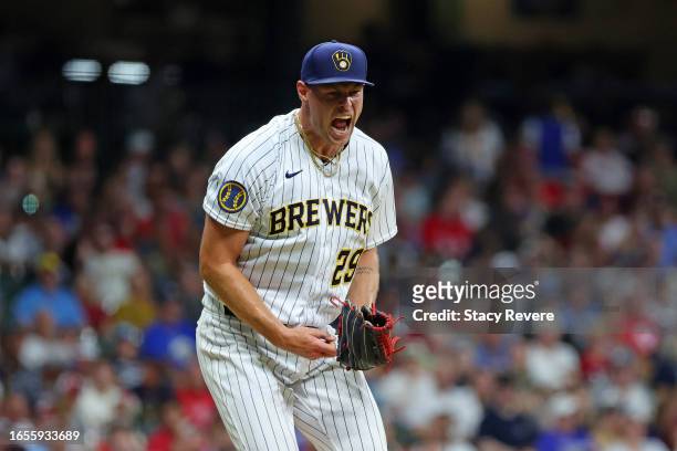 Trevor Megill of the Milwaukee Brewers reacts to a strike out against the Philadelphia Phillies during the seventh inning at American Family Field on...