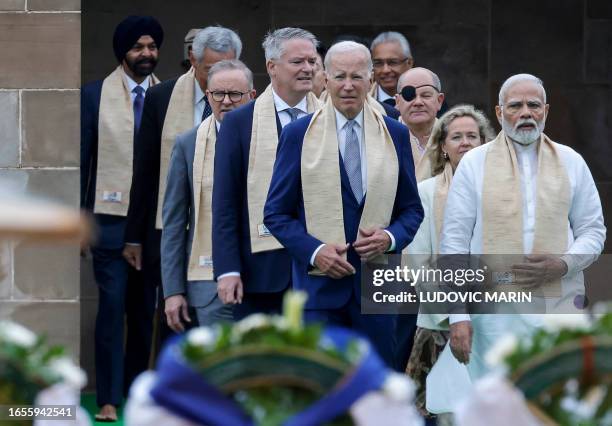 India's Prime Minister Narendra Modi , US President Joe Biden , German Chancellor Olaf Scholz and Australia's Prime Minister Anthony Albanese along...