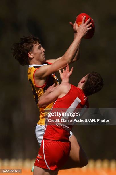 Elwood Peckett of the Stingrays marks the ball against Thomas Hanily of the Power during the Coates Talent League Boys Wildcard Round match between...