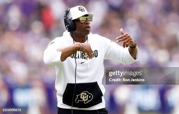 Head coach Deion Sanders of the Colorado Buffaloes calls a play against the TCU Horned Frogs during the first half at Amon G. Carter Stadium on...