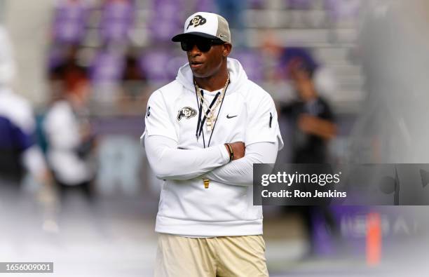 Head coach Deion Sanders of the Colorado Buffaloes walks the field before the game between the TCU Horned Frogs and the Colorado Buffaloes at Amon G....