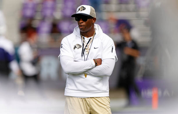 Head coach Deion Sanders of the Colorado Buffaloes walks the field before the game between the TCU Horned Frogs and the Colorado Buffaloes at Amon G....
