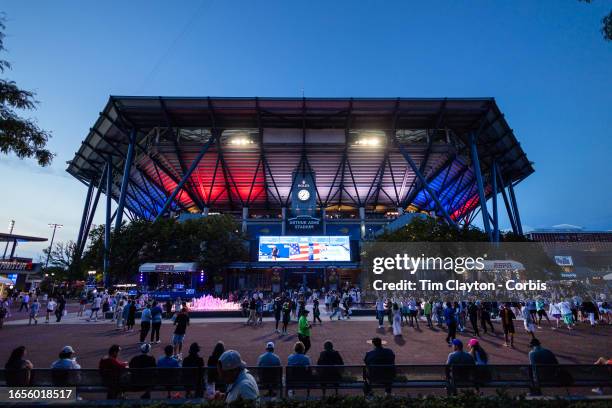 September 2: Arthur Ashe Stadium lit up in red, white, and blue at dusk during the US Open Tennis Championship 2023 at the USTA National Tennis...