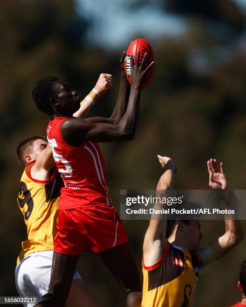 Tew Jiath of the Power attempts to mark the ball during the Coates Talent League Boys Wildcard Round match between Gippsland Power and Dandenong...