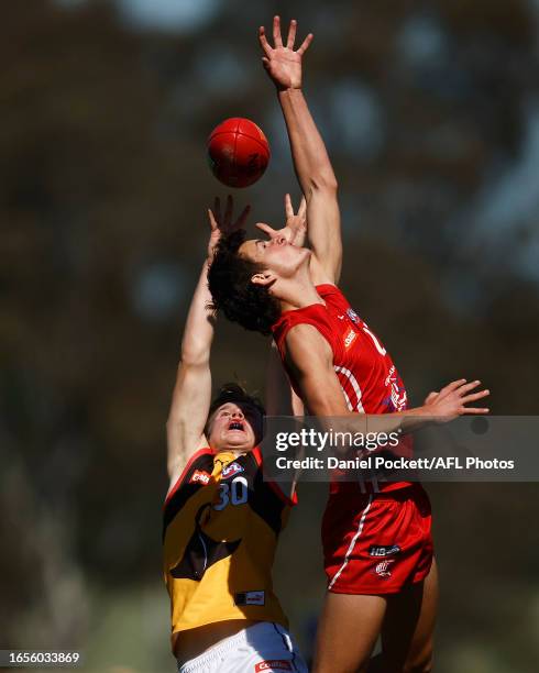 Kane Hurst of the Stingrays and Asher Eastham of the Power contest the ball during the Coates Talent League Boys Wildcard Round match between...