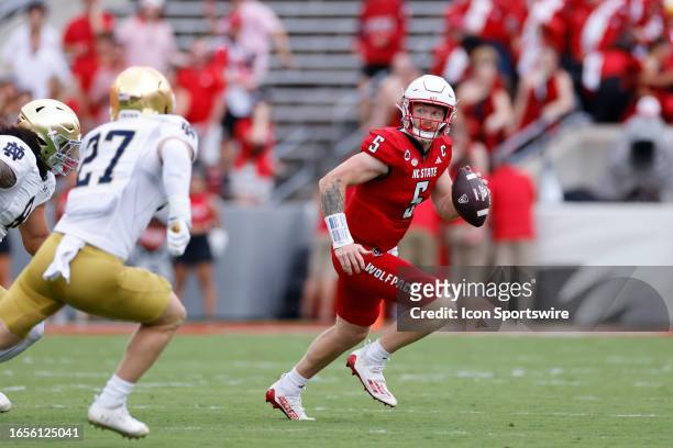 North Carolina State Wolfpack quarterback Brennan Armstrong looks to pass the ball during a college football game against the Notre Dame Fighting...