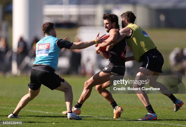 Josh Daicos of the Magpies is challenged during a Collingwood Magpies training and media session at AIA Vitality Centre on September 03, 2023 in...