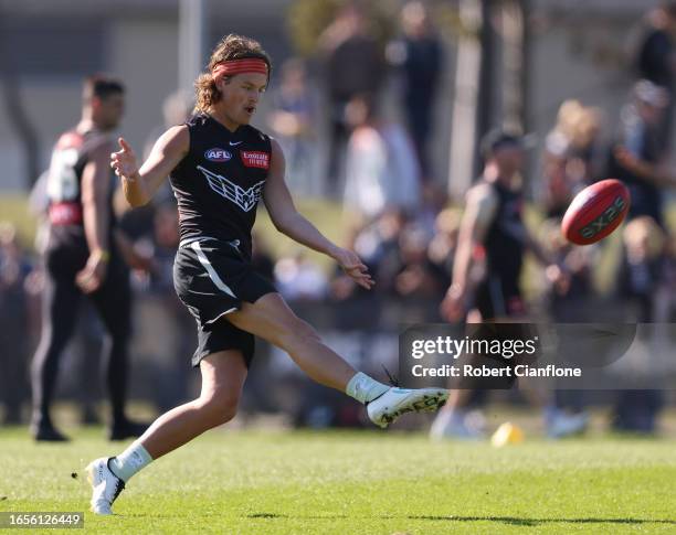 Jack Ginnivan of the Magpies kicks the ball during a Collingwood Magpies training and media session at AIA Vitality Centre on September 03, 2023 in...