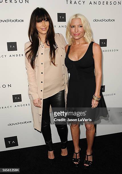 Kim Kardashian and Tracy Anderson attend the opening of Tracy Anderson Flagship Studio on April 4, 2013 in Brentwood, California.