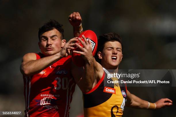 Sebastiano Amoroso of the Power marks the ball against Charlie Rowe of the Stingrays during the Coates Talent League Boys Wildcard Round match...