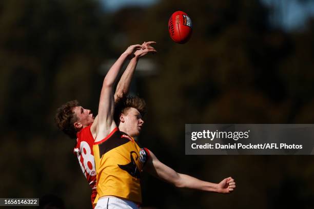 Jay Rankin of the Stingrays and Willem Duursma of the Power contest the ruck during the Coates Talent League Boys Wildcard Round match between...