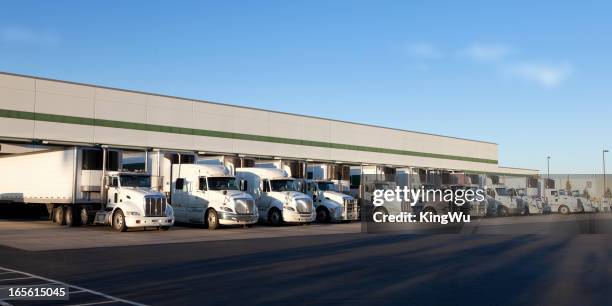 modern distribution center - trucks in a row stock pictures, royalty-free photos & images