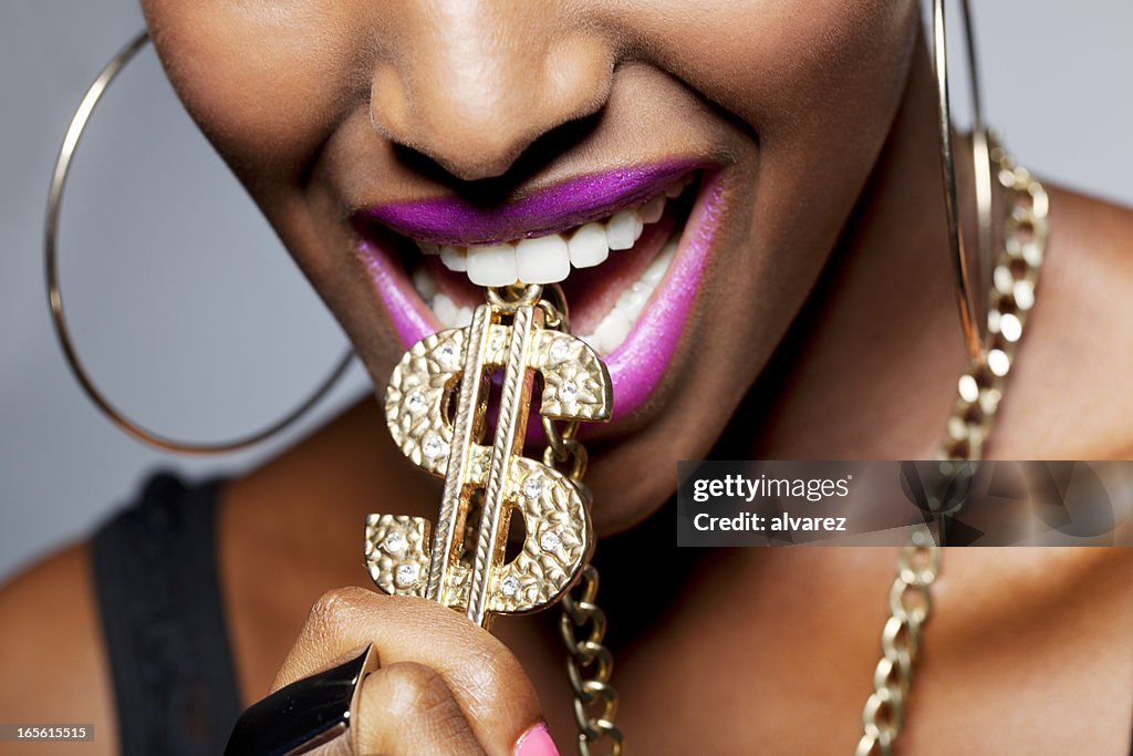 Close Up of Woman's Mouth with Dollar