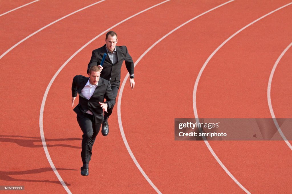 Business competitors on sports track