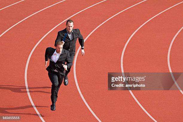 business competitors on sports track - businessman running stock pictures, royalty-free photos & images