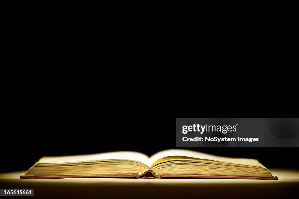 opened magic book - mystery book stock pictures, royalty-free photos & images