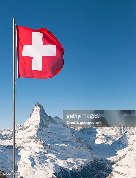 swiss flag and matterhorn - zwitserse cultuur stockfoto's en -beelden