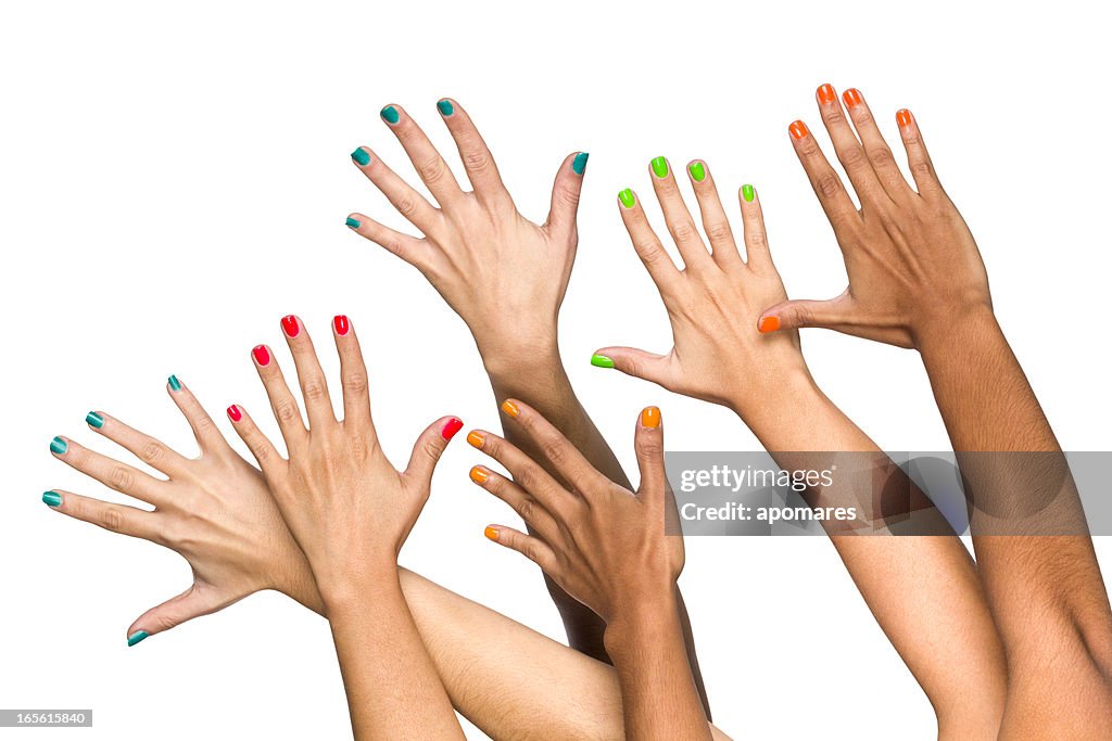 Group of raised multiethnics female hands with colored manicure
