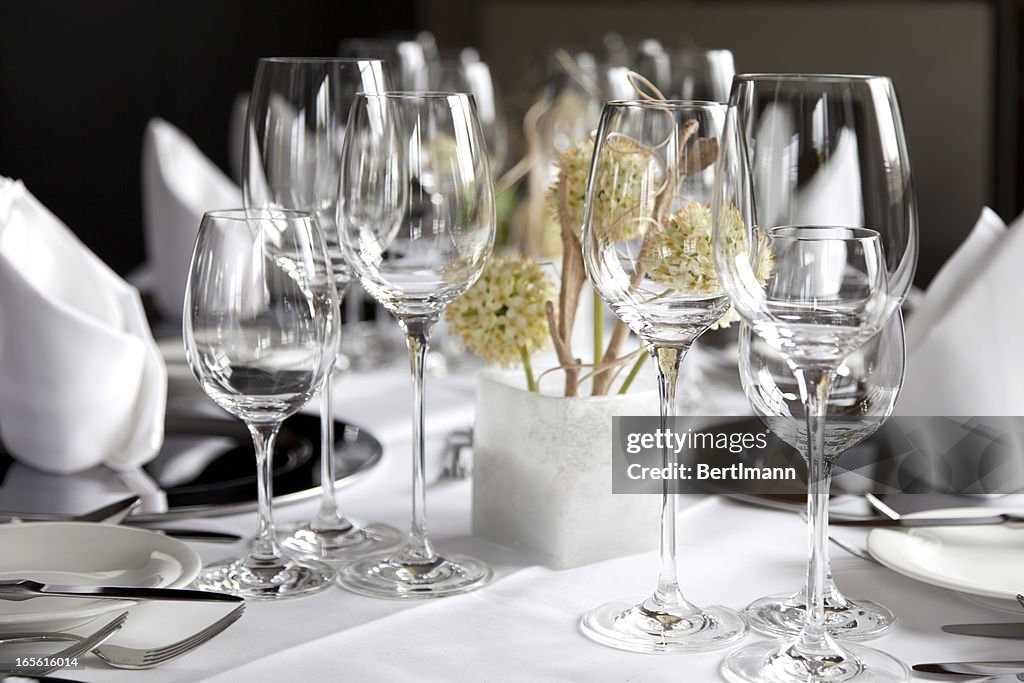 Restaurant table with wine glasses and napkins