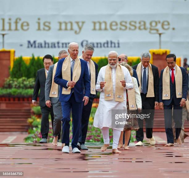 India's Prime Minister Narendra Modi , US President Joe Biden along with world leaders arrive to pay their respect at the Mahatma Gandhi memorial at...
