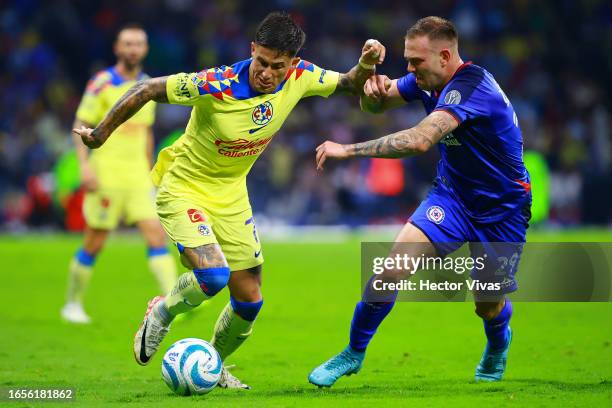 Carlos Rotondi of Cruz Azul battles for possession with Brian Rodriguez of America during the 7th round match between Cruz Azul and America as part...