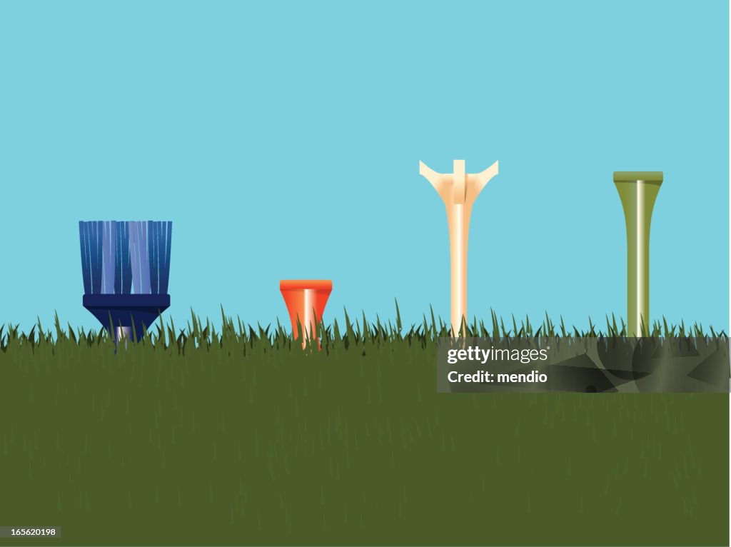 Golf tees on grass
