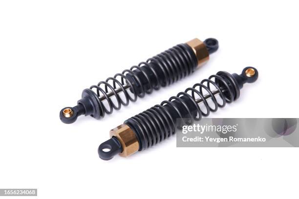 pair of car shock absorbers isolated on white background - pezzo di ricambio foto e immagini stock