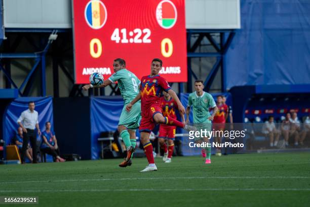 Max Lovera and Pavel Savitskiy of Bielorrusia competes for the ball with during the UEFA EURO 2024 qualifying round group I match between Andorra v...