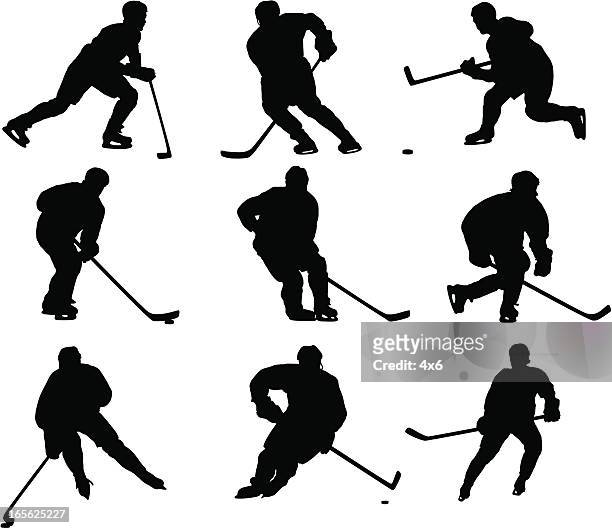 stockillustraties, clipart, cartoons en iconen met hockey player silhouettes - ice hockey