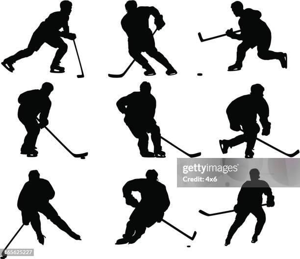 hockey player silhouettes - hockey puck white background stock illustrations