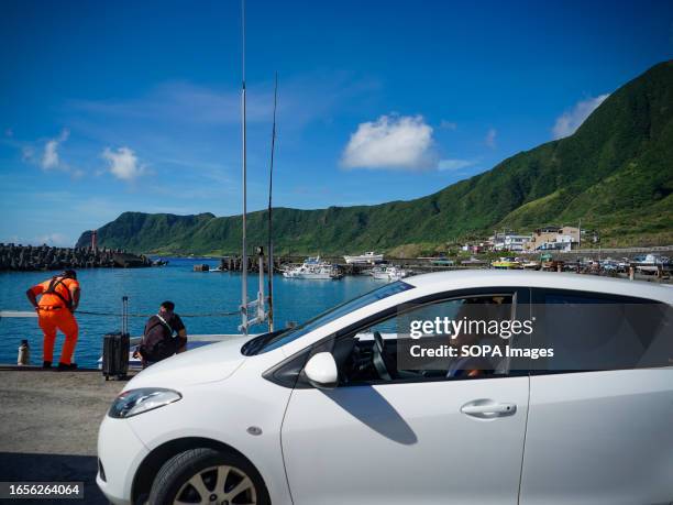 Driver seen resting at the pier on Orchid Island. Orchid Island , also known as Pongso no Tao , is a volcanic island near the southeastern coast of...