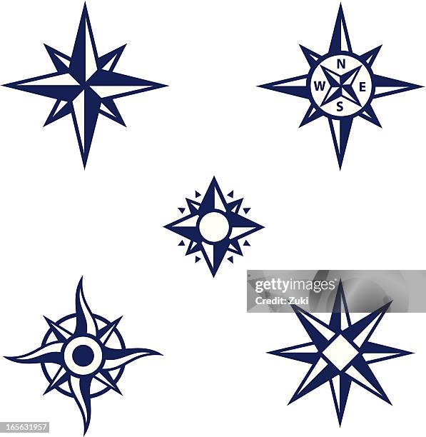 an assortment of dark blue compass symbols - sailing compass stock illustrations