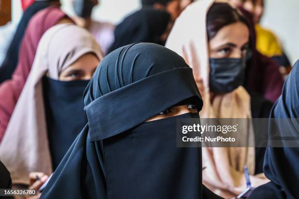 Burqa Clad Or Hijab wearing girl listens to a speaker during world Suicide Prevention Day in Sopore District Baramulla Jammu and Kashmir India on 10...