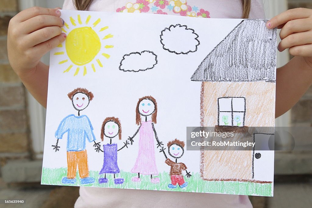 Girl Holds Drawing of Her Family