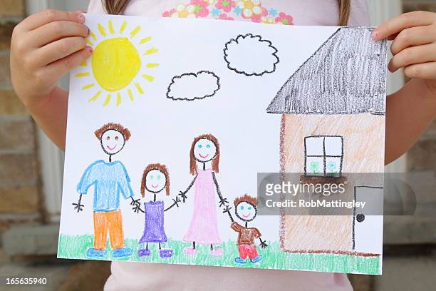 girl holds drawing of her family - drawing bildbanksfoton och bilder