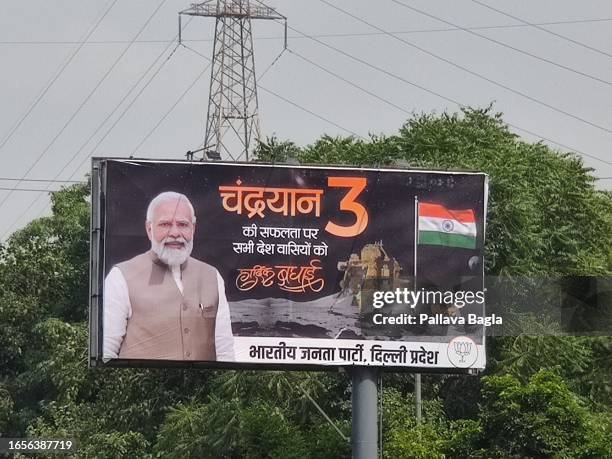 Bill boards adorn street sides in India, as the country of 1.4 billion people celebrates the successful soft landing on the moon surface by...