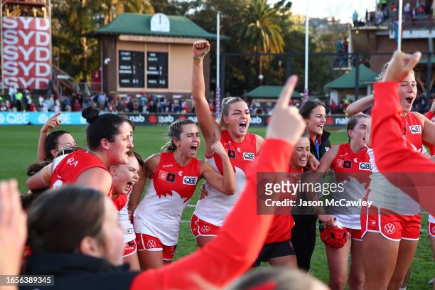 Ally Morphett of the Swans and teammates celebrate victory following the round one AFLW match between Sydney Swans and Greater Western Sydney Giants...